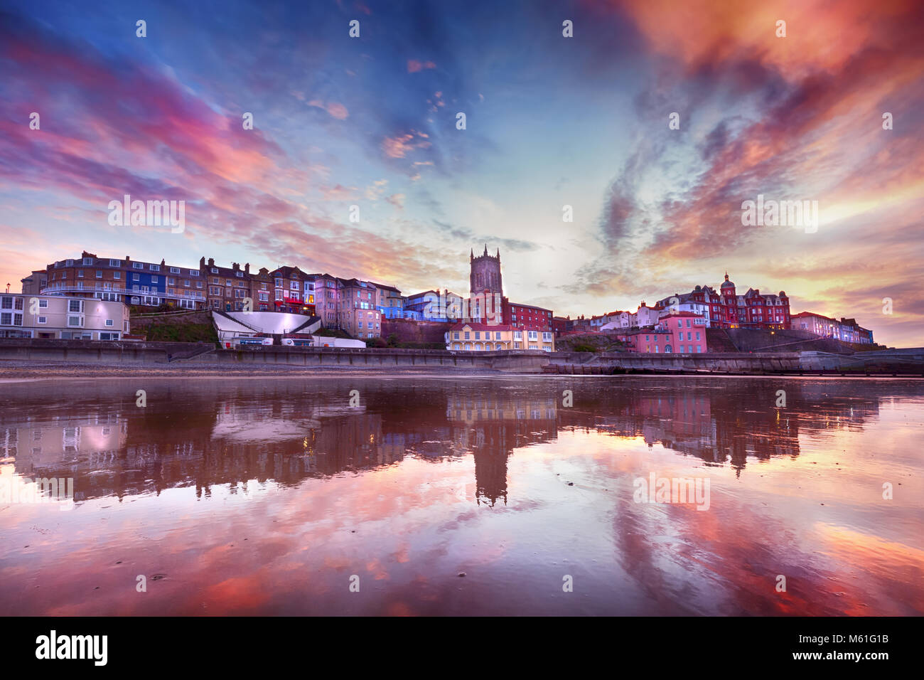 Skies ablaze in Cromer town - Fabulous looking sky and reflection surround the picturesque seaside town of Cromer. As dusk appears, the soft lights of Stock Photo