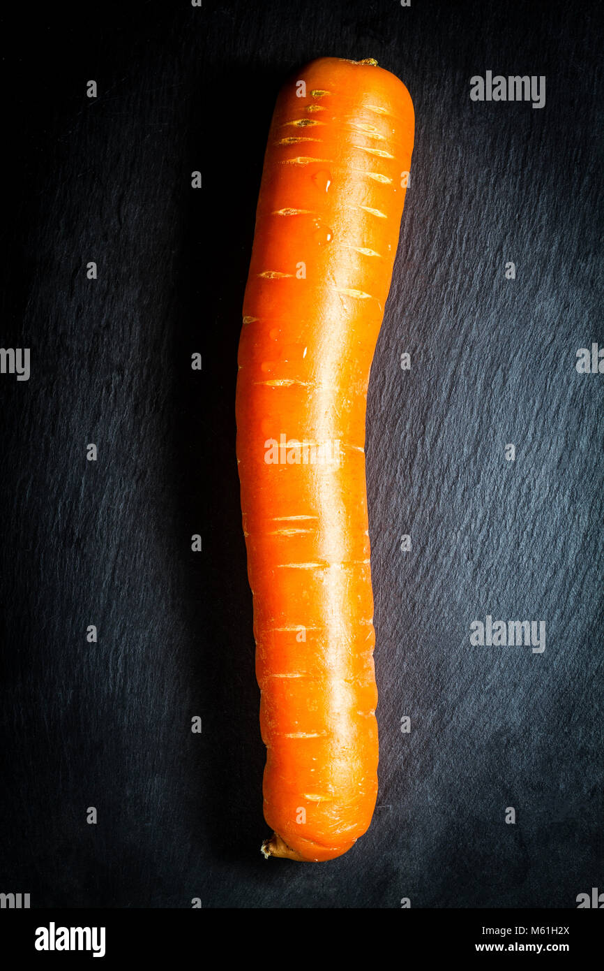 Carrot on black slate board. Florianopolis, Santa Catarina, Brazil. Stock Photo