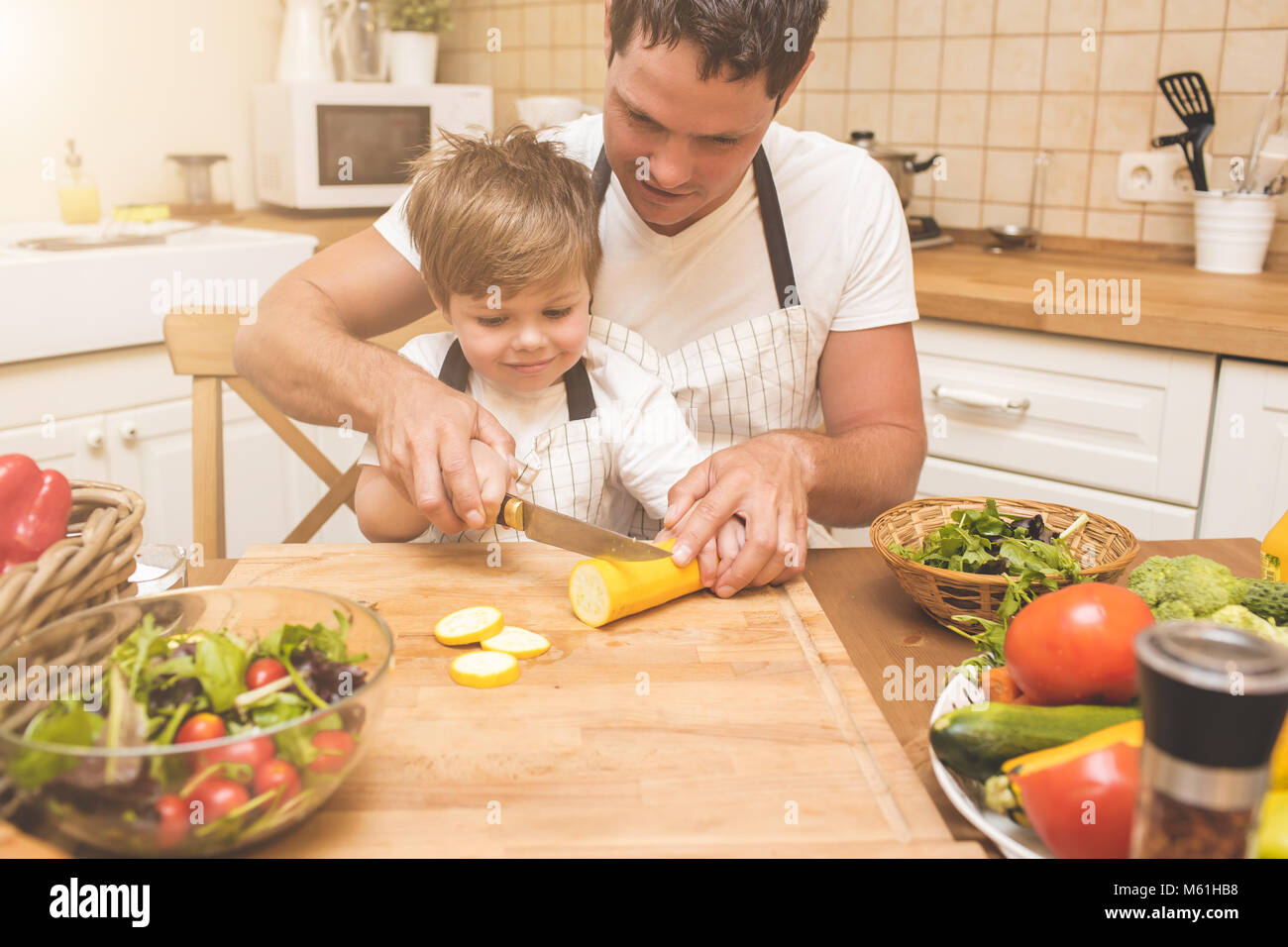Father is cooking with his son Stock Photo