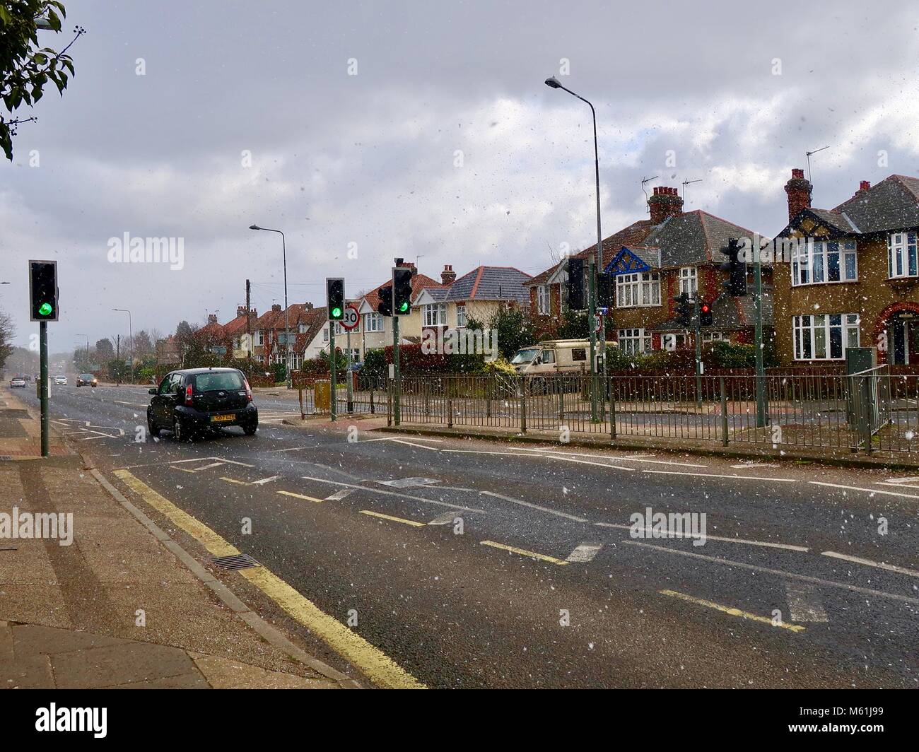 UK weather Light snow falling in Woodbridge Road, Ipswich, Suffolk