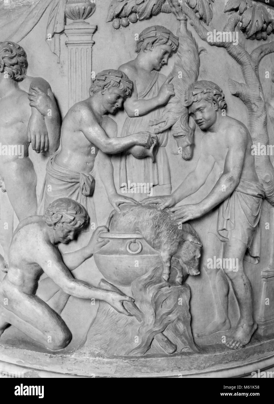 Carved relief of men hunting and cooking, Sistine Chapel, Rome, 2017. Stock Photo