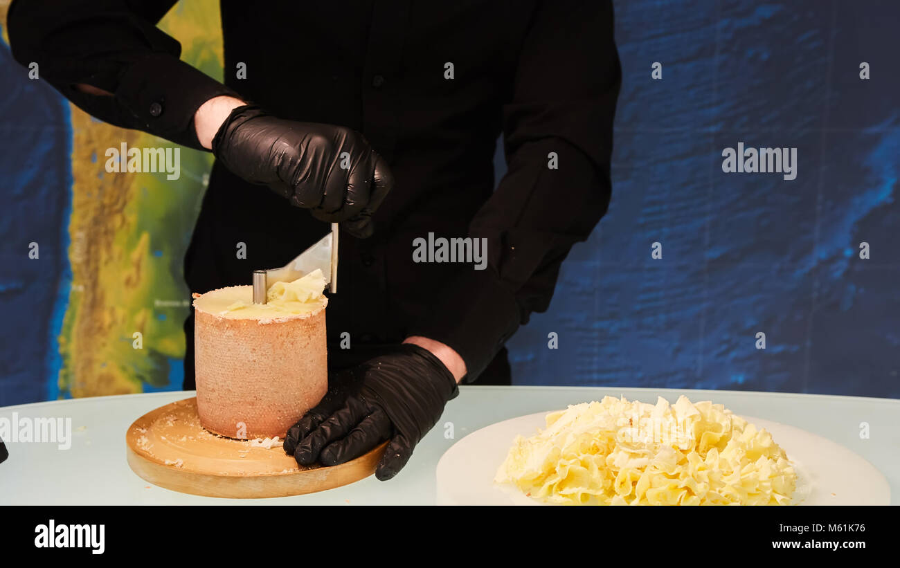 https://c8.alamy.com/comp/M61K76/special-cheese-knives-the-girolle-scraper-making-cheese-shaving-on-M61K76.jpg