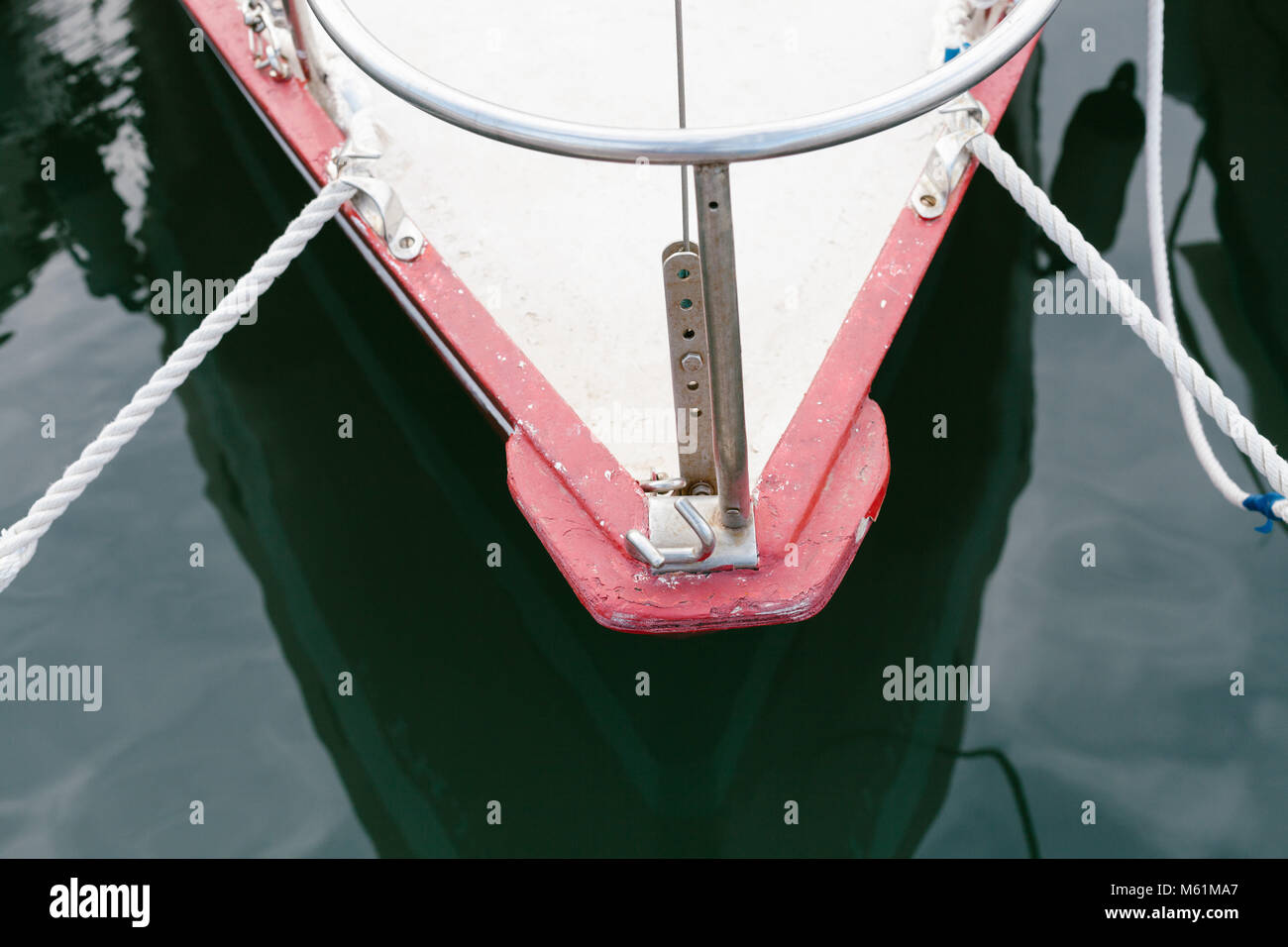 Nose of small boat on background of calm water. Stock Photo