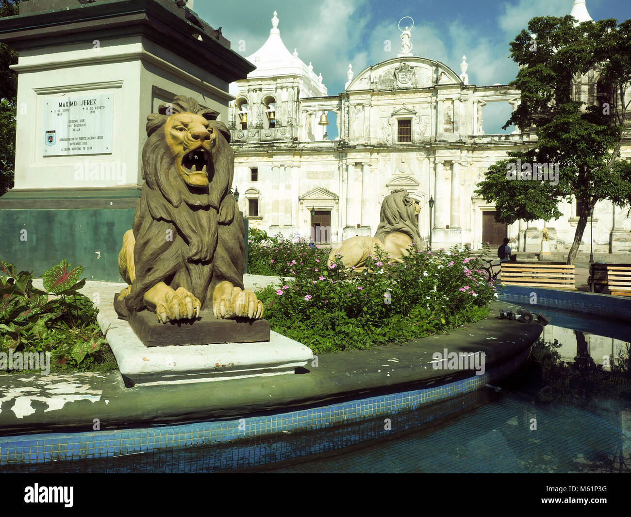 lion statues Parque Central with Cathedral Leon in background Nicaragua Central America with tomb of Maximo Jerez Stock Photo