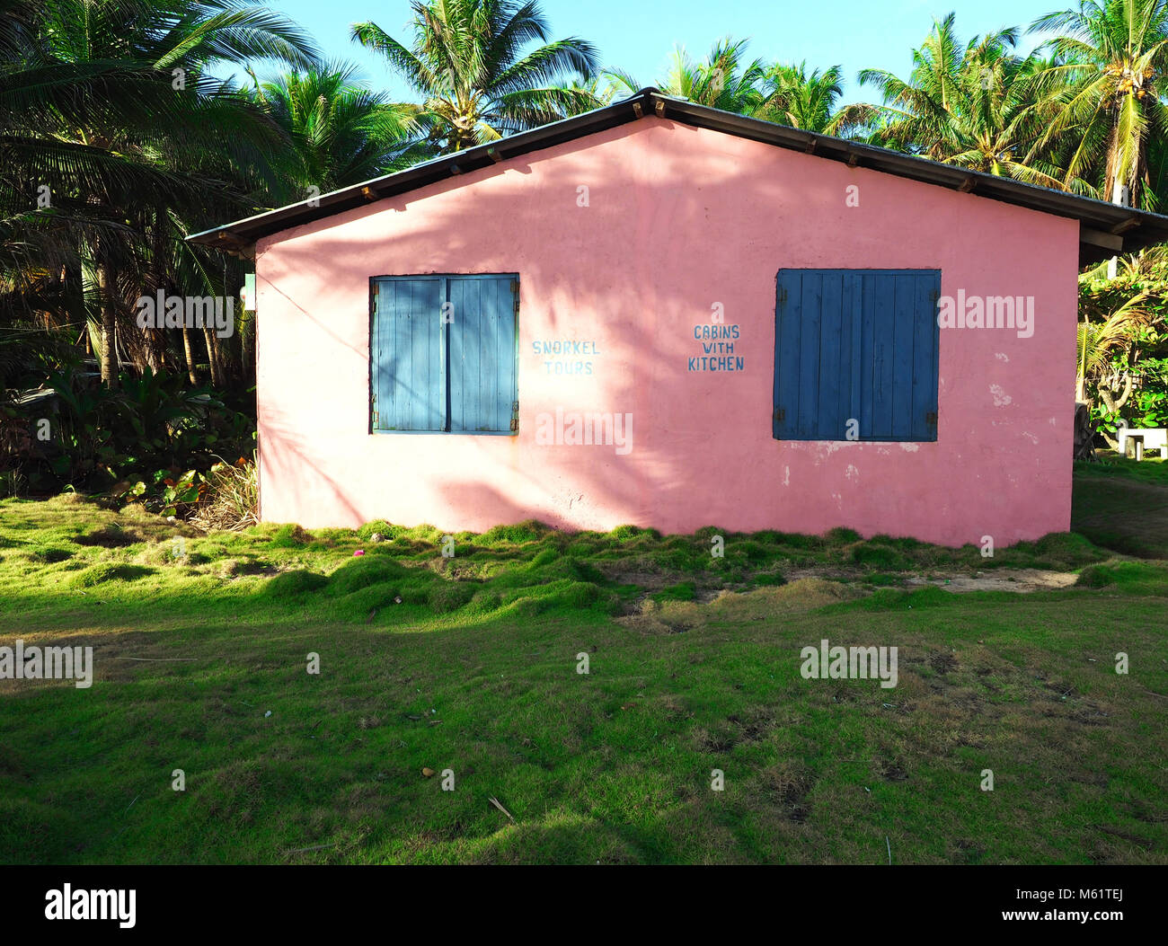 colorful pink cabin for rent third world Big Corn Island Nicaragua  Central America Stock Photo