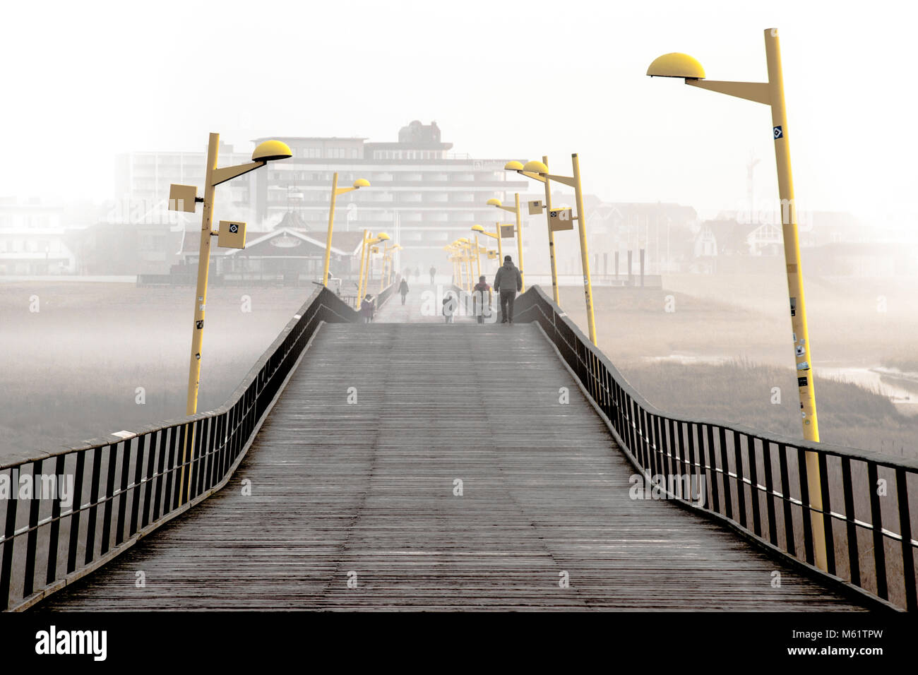 Starting point and destination for extensive hikes: The Ambassador Hotel & Spa and promenade pier in St Peter Ording, seaside resort, Germany Stock Photo