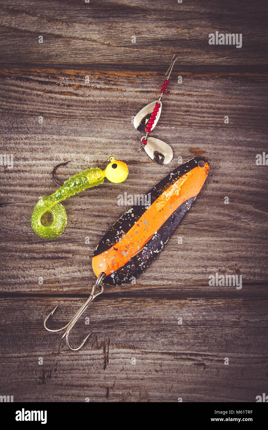 fishing rod with lure over wood background Stock Photo Alamy