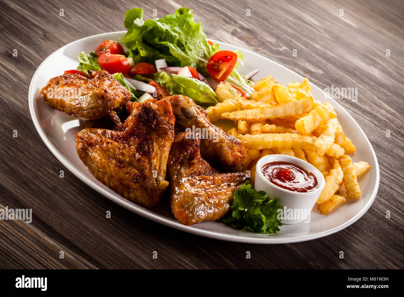 Chicken Wings French Fries Salad Stock Photos & Chicken Wings French ...