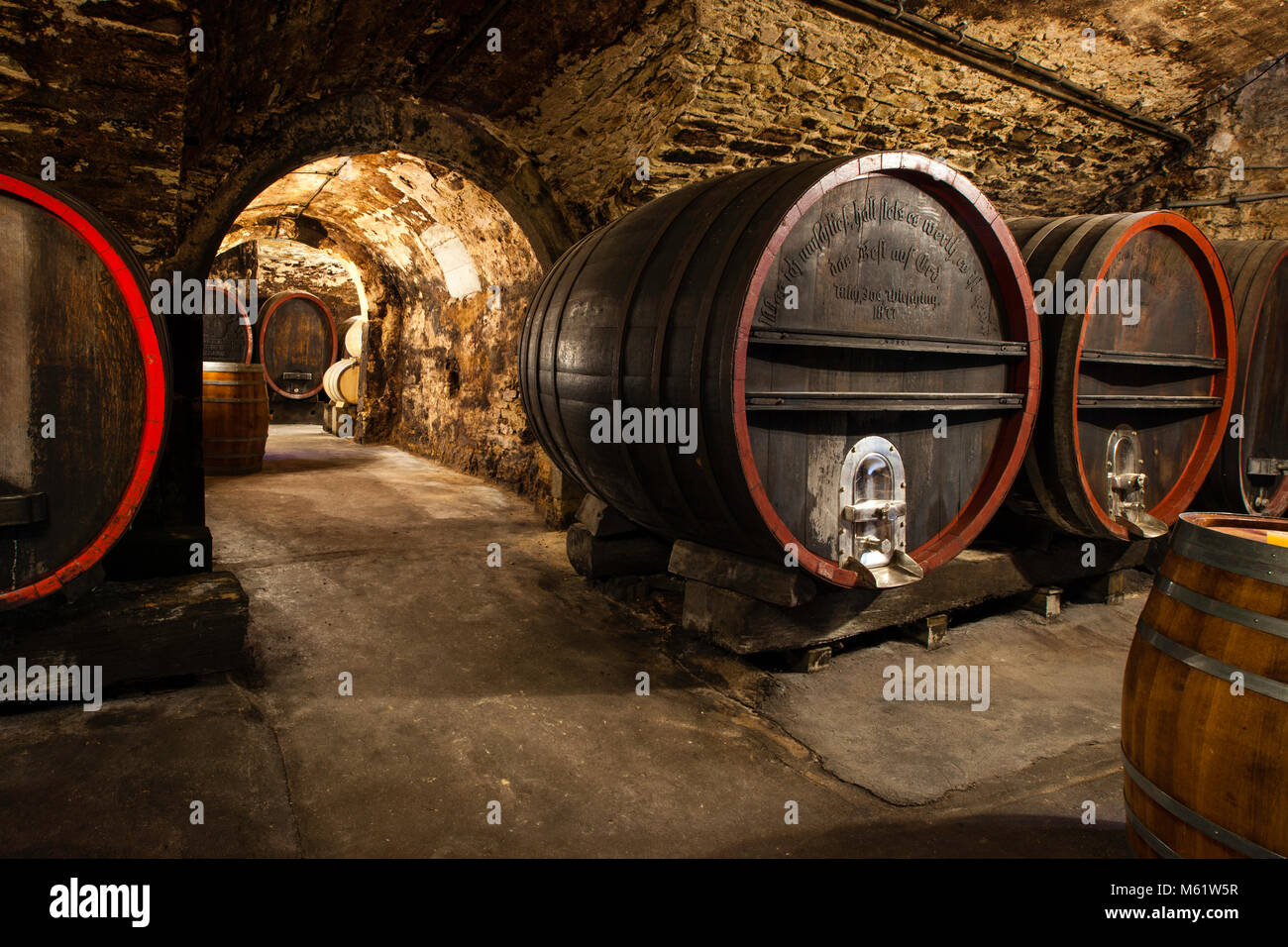 Historical German wine cellar with wooden barrels in Franconia Stock