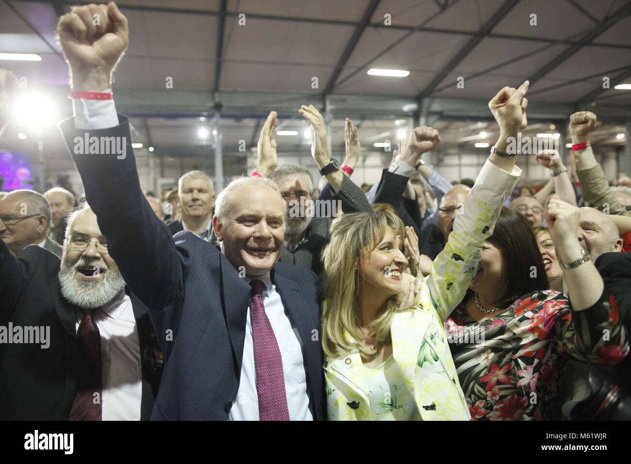 Sinn Fein's Martina Anderson, centre celebrates with party members Michelle Gildernew, right, and Martin McGuinness, left, after topping the poll at the Kings Hall count centre, Belfast, Northern Ireland, Monday, May 26, 2014. Anderson topped the poll in the European elections for Northern Ireland, She polled 159,813 votes, beating the quota by over 3,000 votes to become the first of Northern Ireland's MEP's. Photo/ Paul McErlane Stock Photo