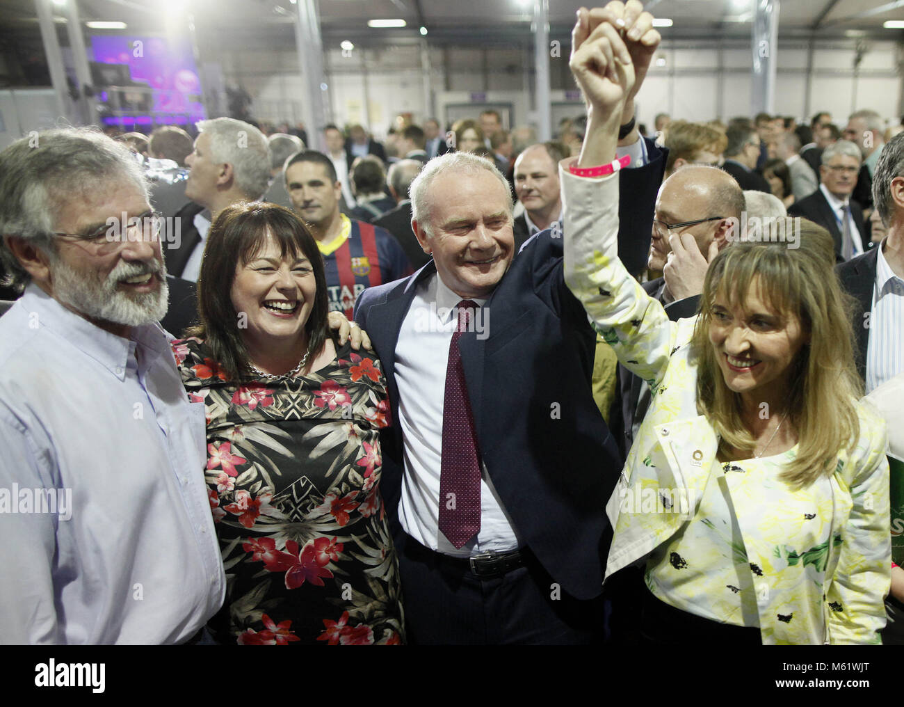 Sinn Fein's Martina Anderson, centre celebrates with party members Michelle Gildernew, right, and Martin McGuinness, left, after topping the poll at the Kings Hall count centre, Belfast, Northern Ireland, Monday, May 26, 2014. Anderson topped the poll in the European elections for Northern Ireland, She polled 159,813 votes, beating the quota by over 3,000 votes to become the first of Northern Ireland's MEP's. Photo/Paul McErlane Stock Photo