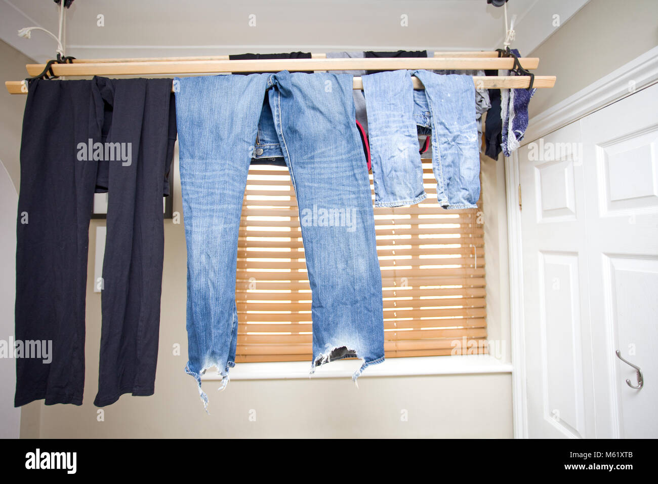clothes drying inside home Stock Photo