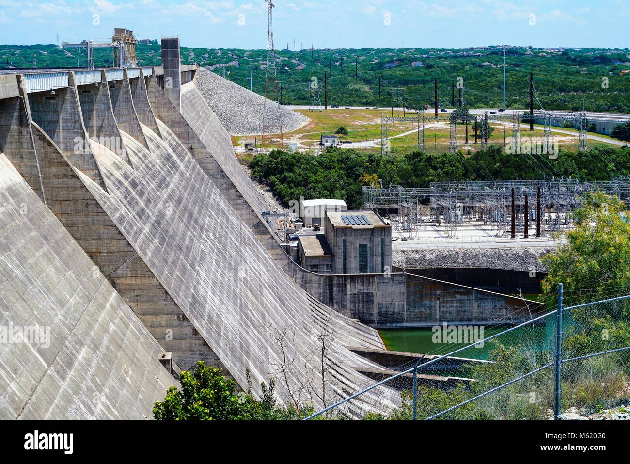 The Mansfield dam on Lake Travis was built to help control flooding and generate hydroelectric power for the area near Austin Texas. Stock Photo