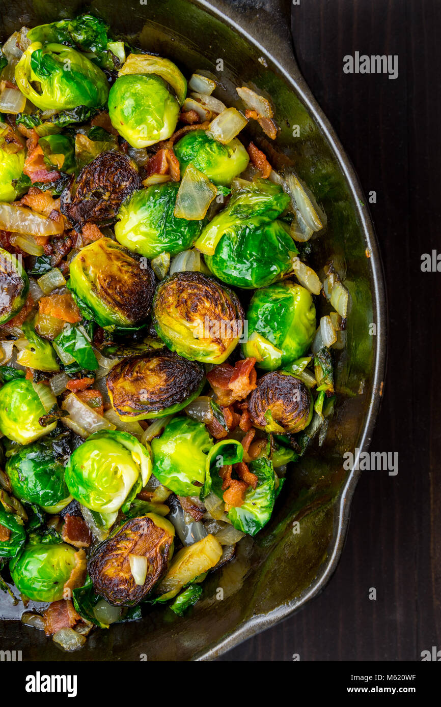 Half View of Roasted Brussels Sprouts and Bacon in Cast Iron Skillet