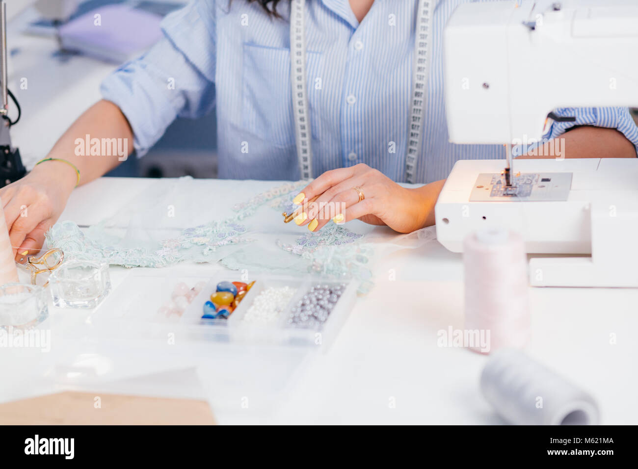 closeup cropped photo of decorating fabric with beads Stock Photo Alamy