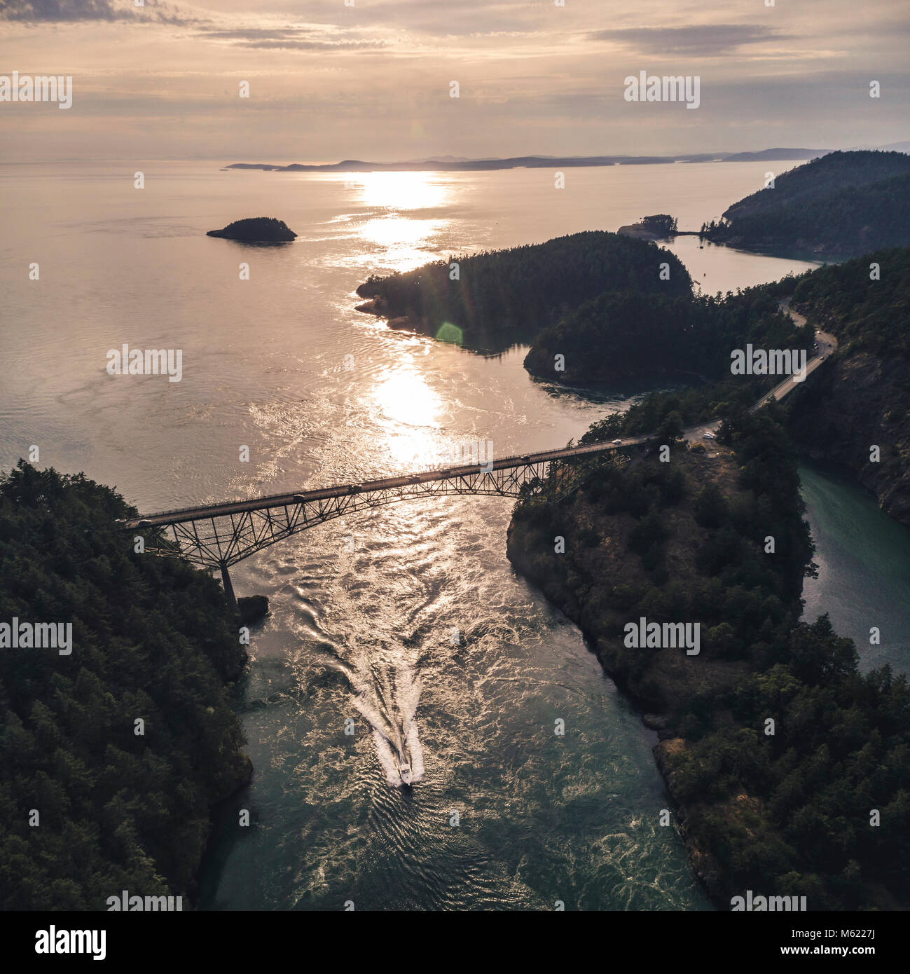 Helciopter view of Deception Pass Bridge at golden hour with colorful island contrast Stock Photo