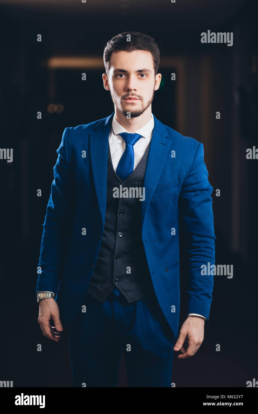 happy businessman with arms crossed standing in office Stock Photo - Alamy