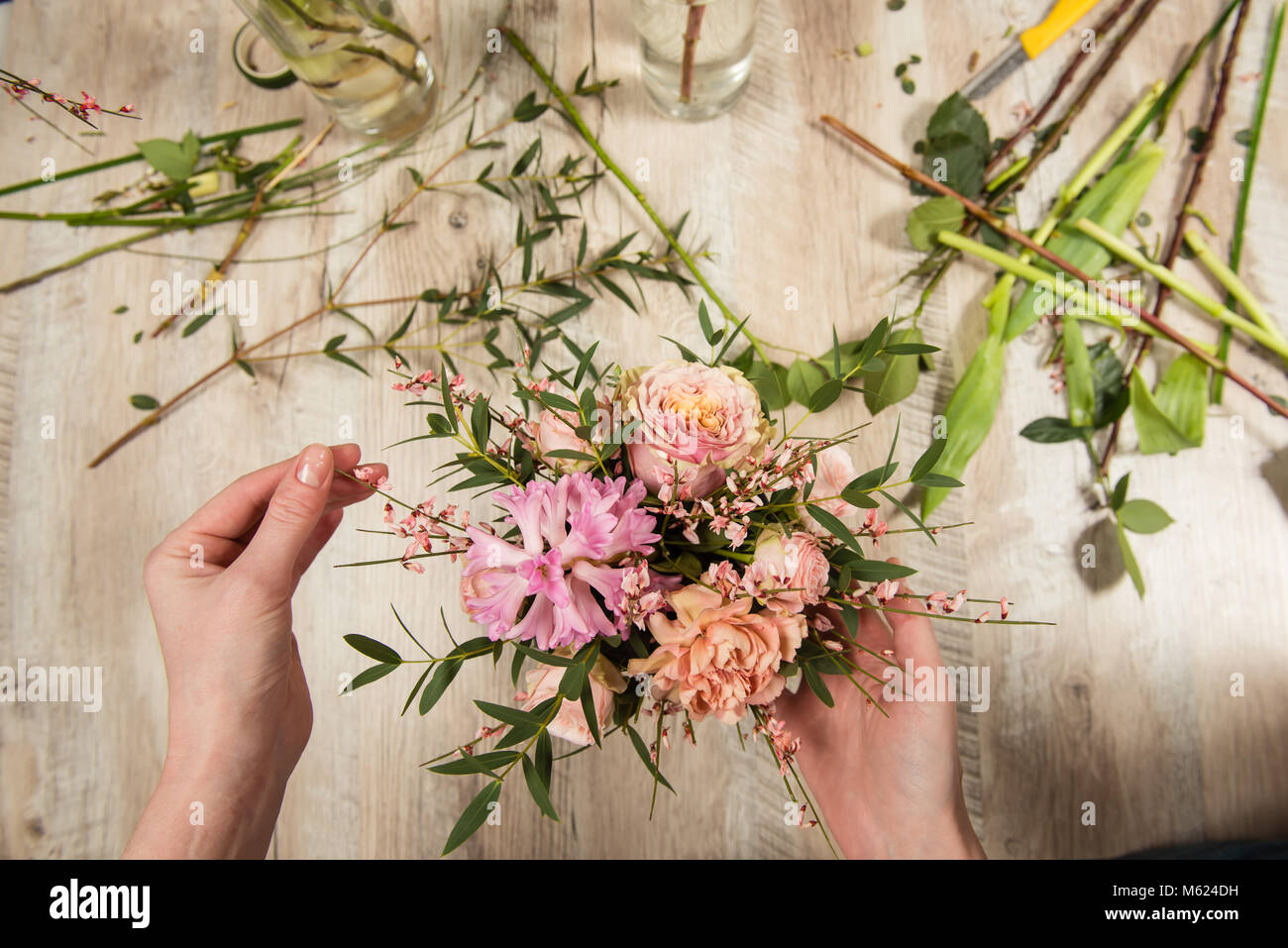 Flower pink and pastel composition in female hands Stock Photo