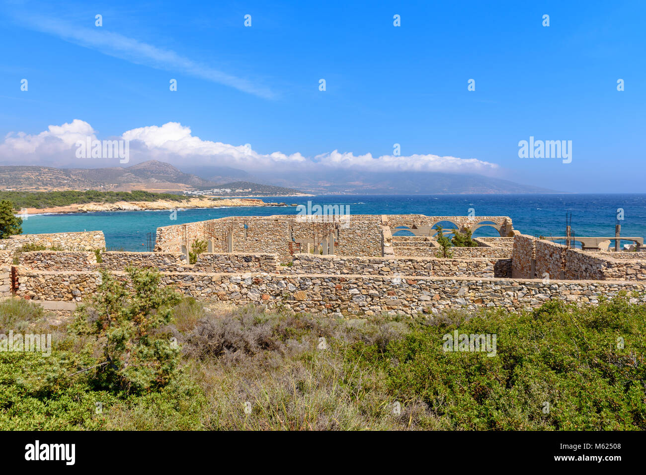 Hotel building under construction with a view of the sea on western side of Naxos island. Cyclades, Greece Stock Photo