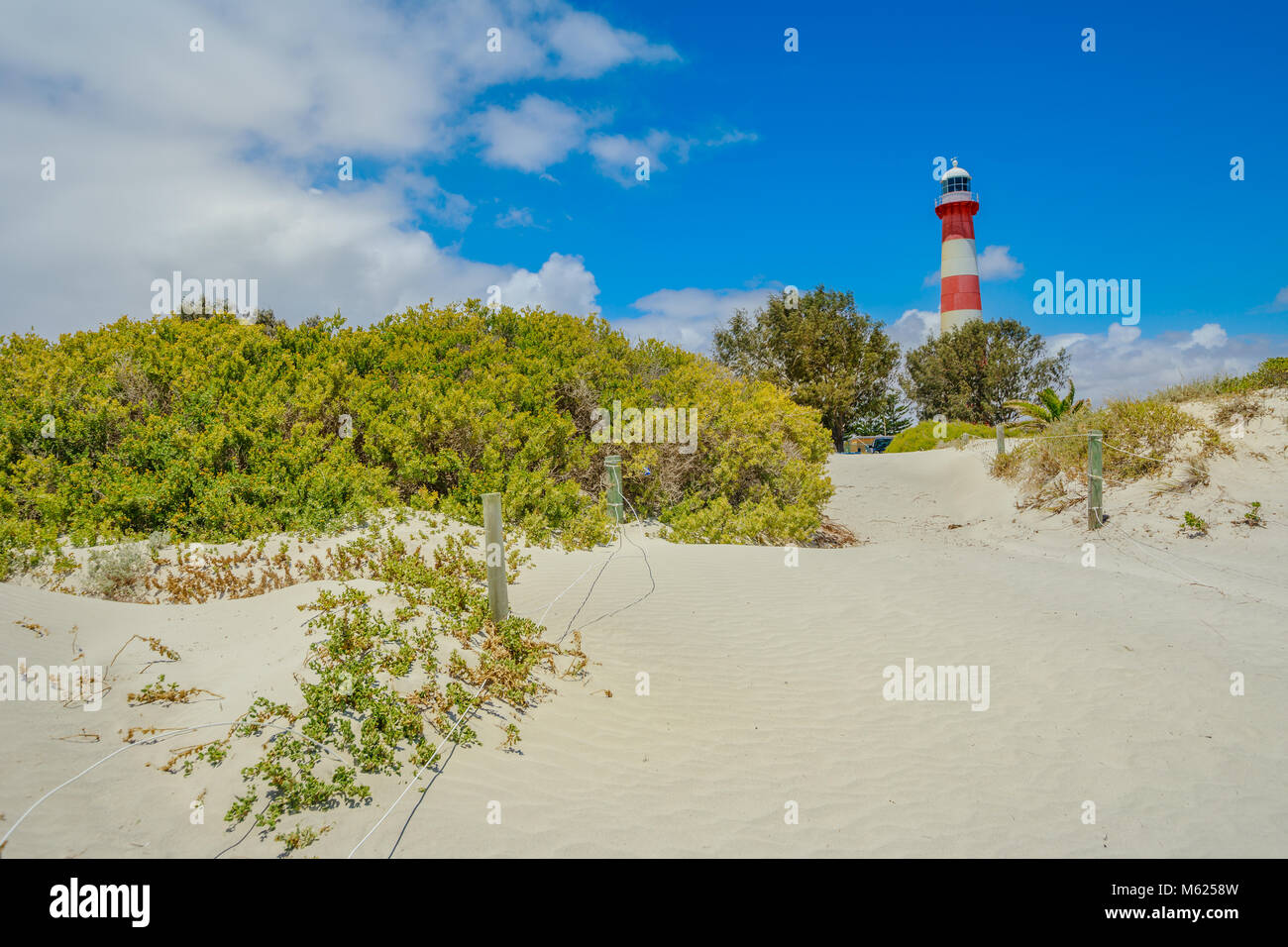 Scenic red and white Moore Lighthouse Point on blue sky in Geraldton
