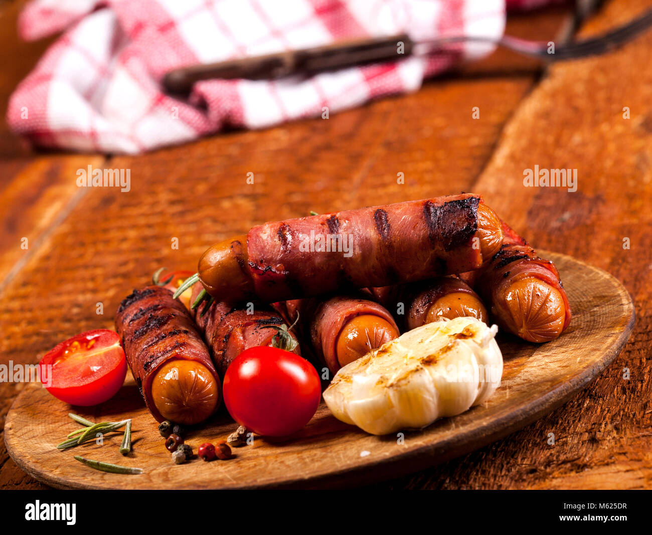 Festive cocktail sausages wrapped in crispy smoked bacon commonly known as 'Pigs in Blankets' on
