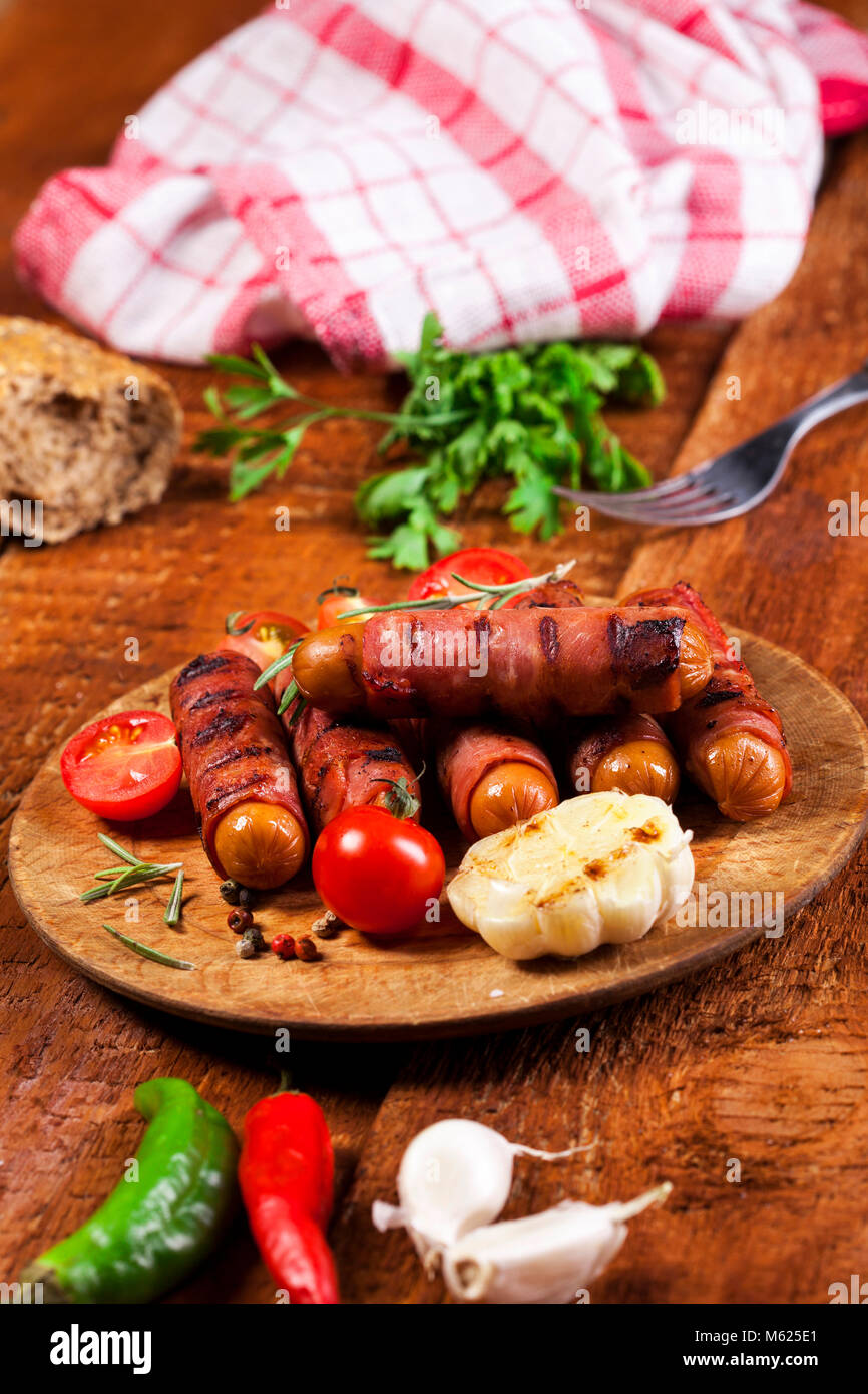 Festive cocktail sausages wrapped in crispy smoked bacon commonly known