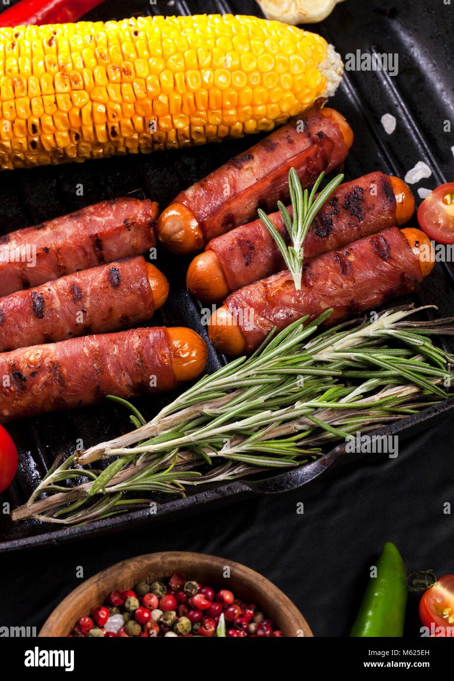 Festive cocktail sausages wrapped in crispy smoked bacon commonly known