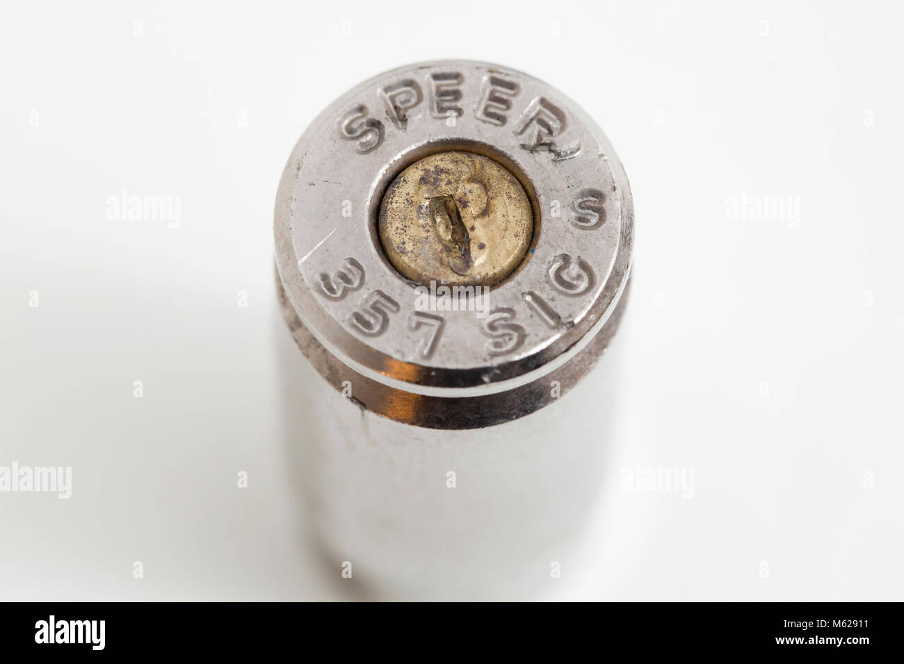 Close up of firing pin tool mark on a Speer 357 Sig spent bullet cartridge Stock Photo