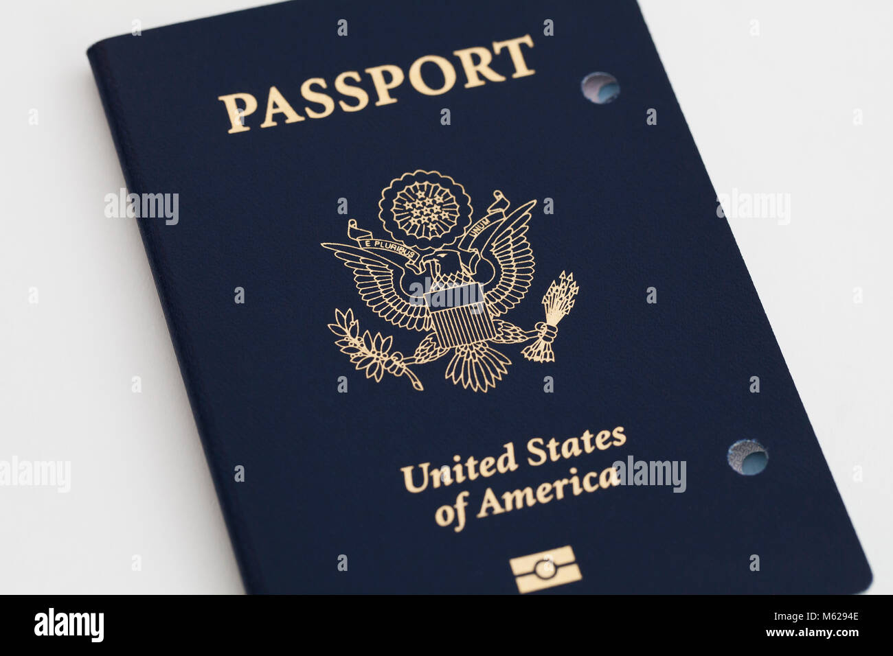 Expired and cancelled US Passport showing holes punched - USA Stock Photo