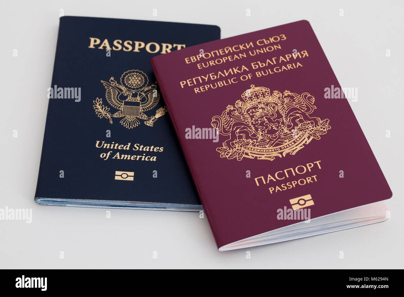 Two different passports, USA and Bulgaria, side by side Stock Photo