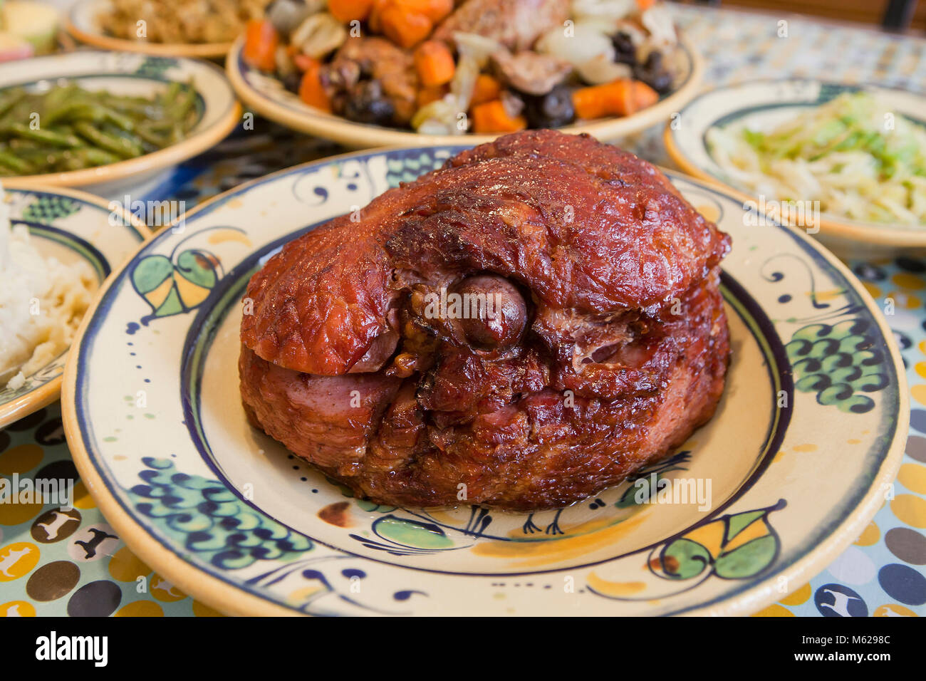 Gammon ham on plate at dinner table - USA Stock Photo