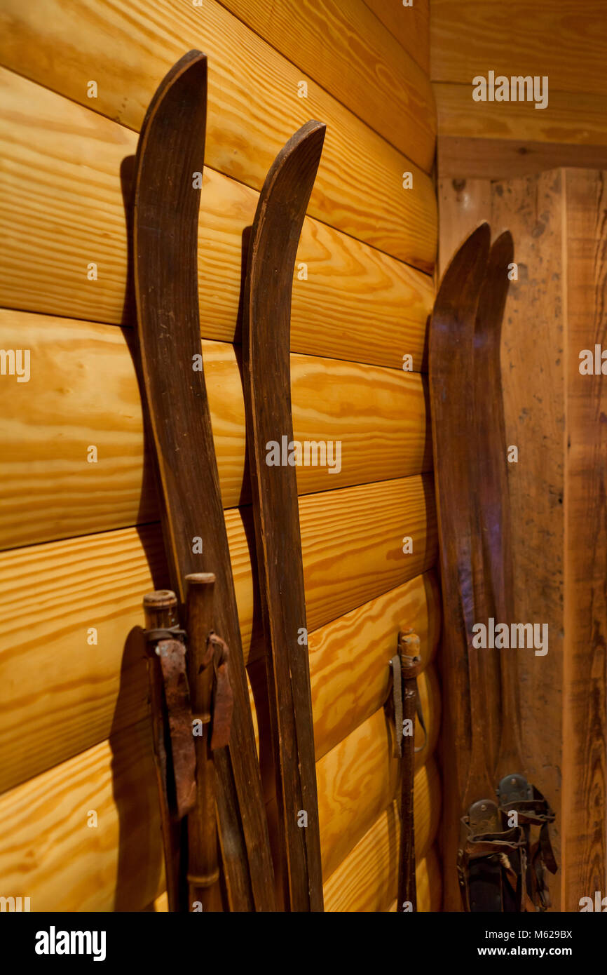 Vintage wooden skis against wall - USA Stock Photo