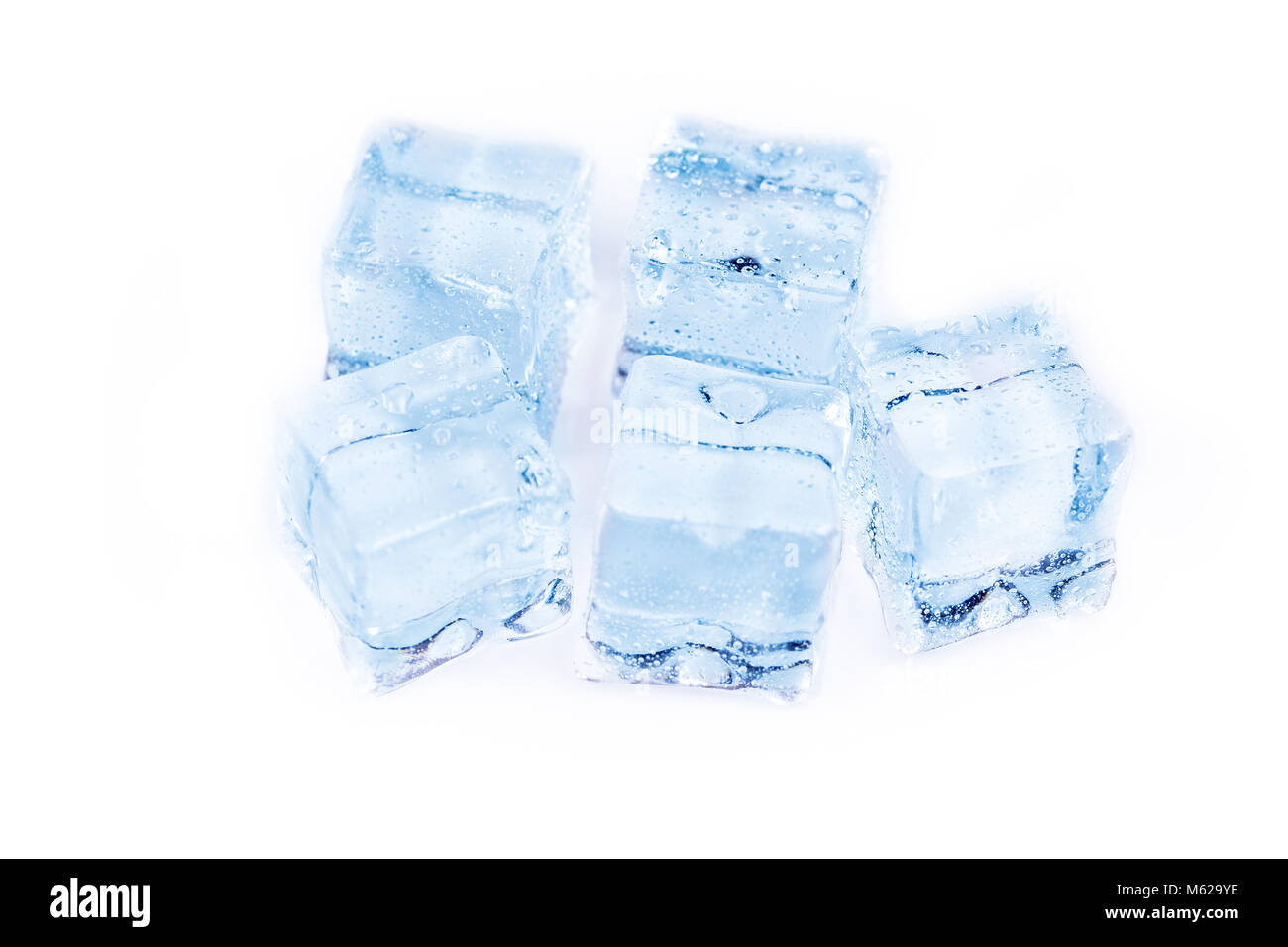 Many ice cubes on white reflection background Stock Photo - Alamy
