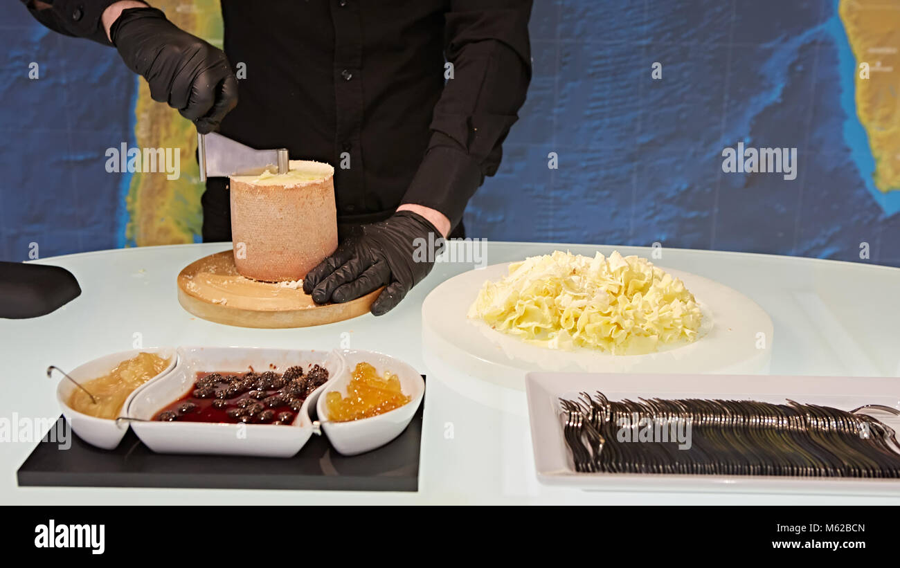 https://c8.alamy.com/comp/M62BCN/special-cheese-knives-the-girolle-scraper-making-cheese-shaving-on-M62BCN.jpg