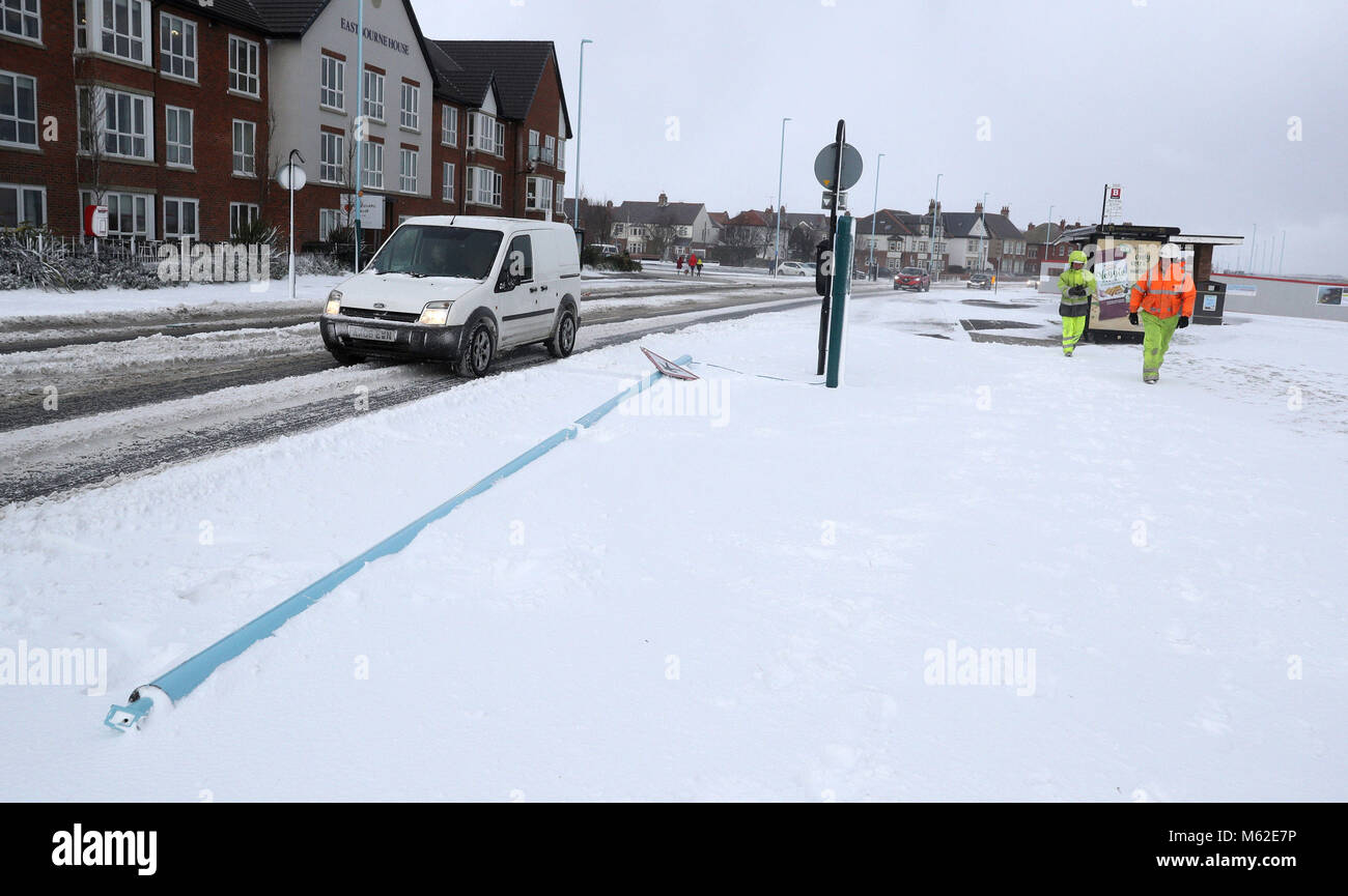 A sign post lies on the ground after it snapped in Whitley Bay, North Tyneside, as wintry conditions have caused more misery for travellers overnight. Stock Photo