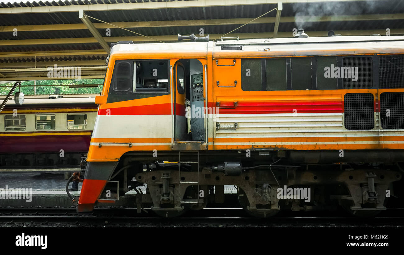 Old diesel train running for reconnect at a platform of railway station