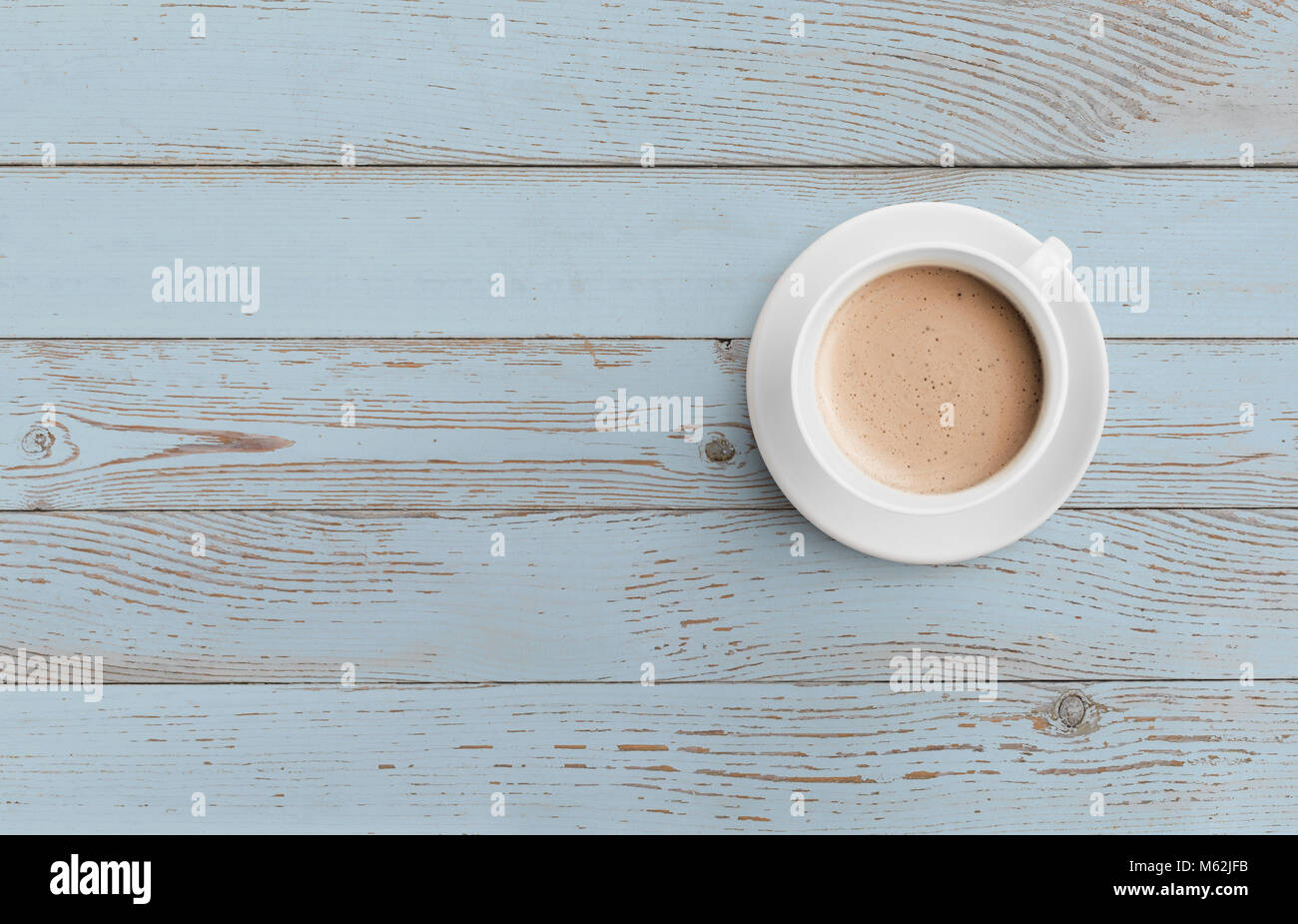 coffee cup on blue wooden table top view Stock Photo