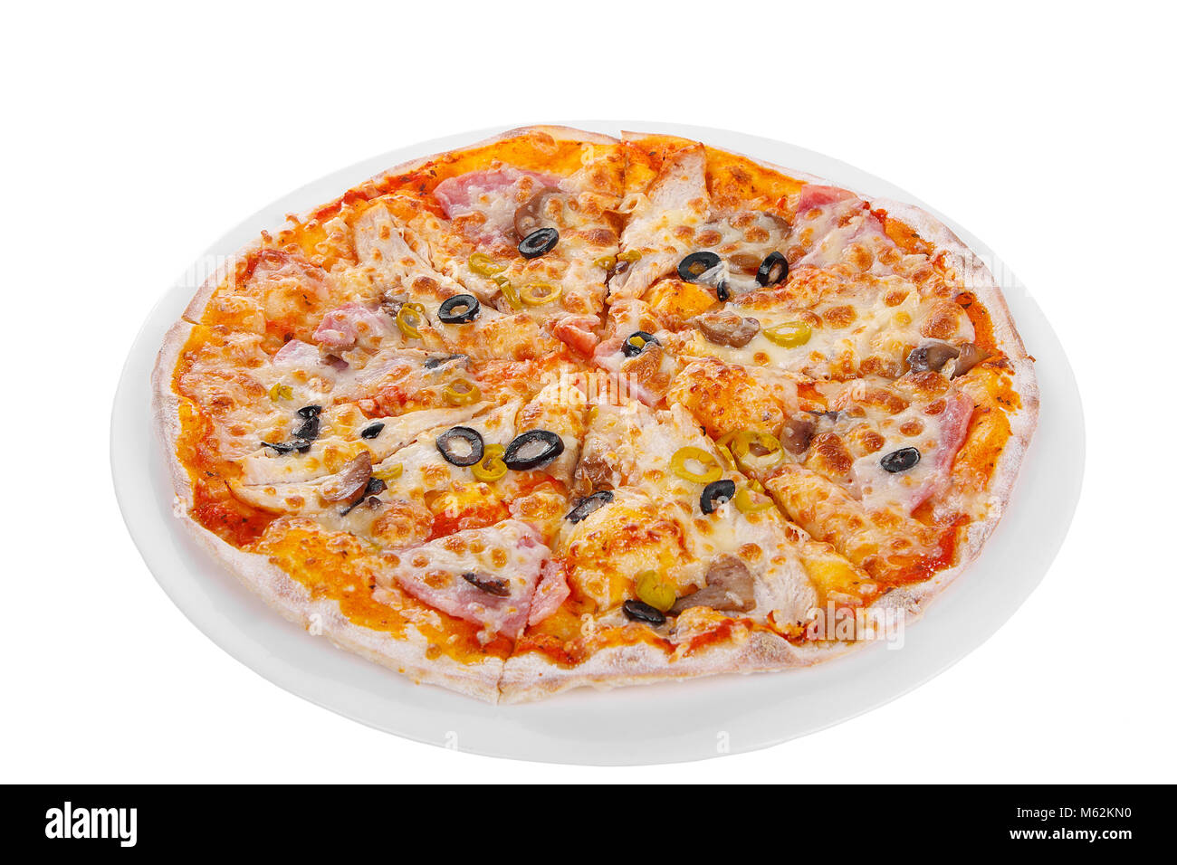 Pizza whole round, cut into pieces, on a white isolated background ...