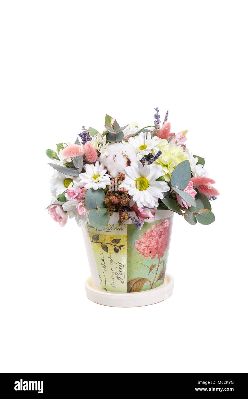 Bouquet in a pot of yellow, white chrysanthemums, chamomile, eucalyptus, lavender, cotton, eustoma, cloves. A holiday, a gift for a woman. Smart Side  Stock Photo