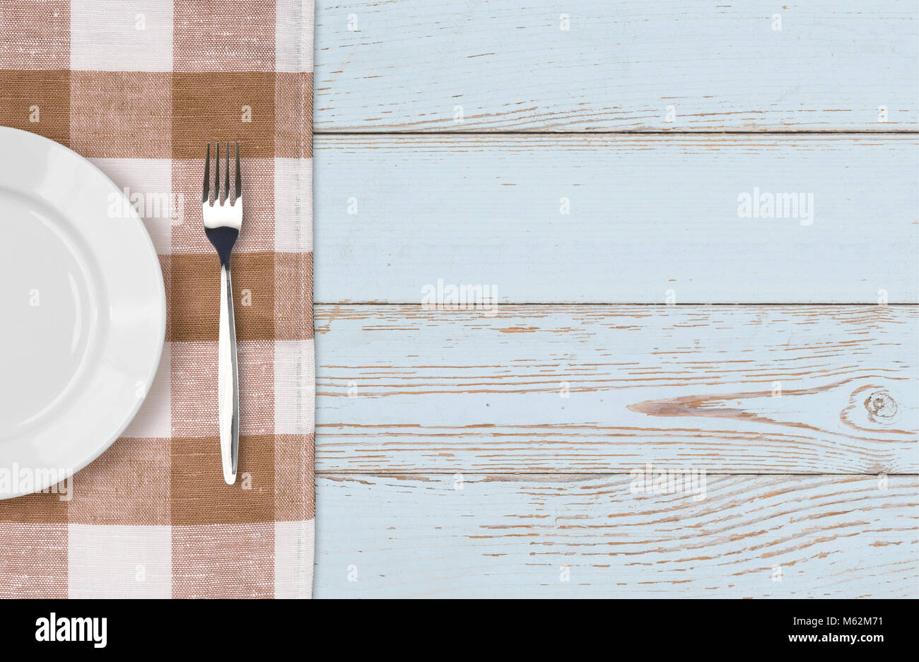 dinner plate and fork setting top view Stock Photo