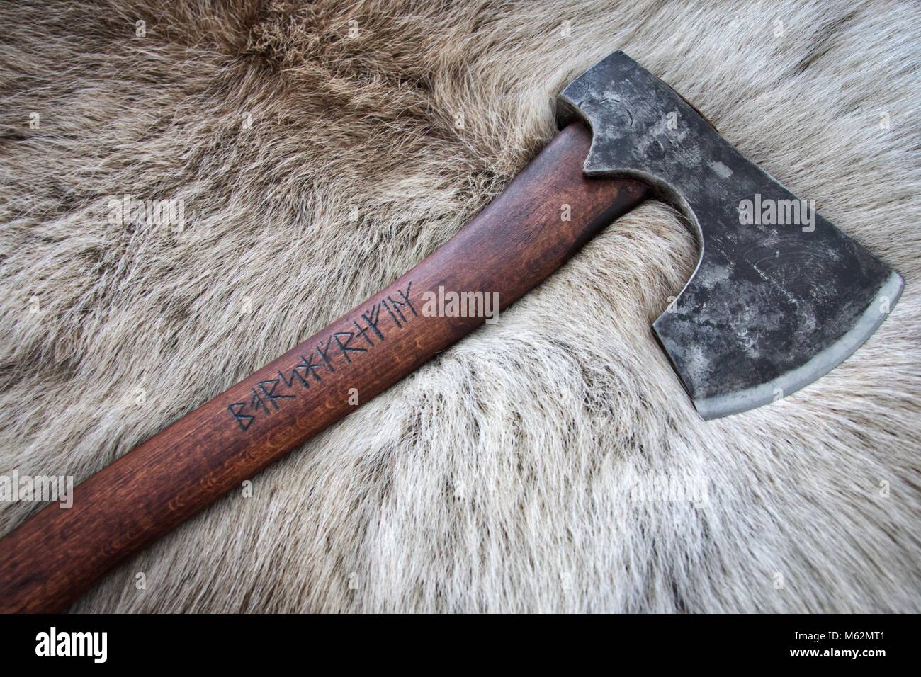Battle ready bearded Viking axe with runic inscriptions on a ...