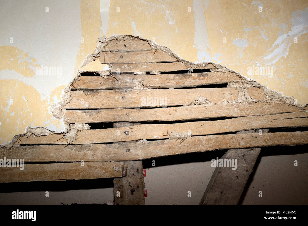 Traditional lath and plaster wall with horse hair in old Cotswold farm house UK Stock Photo