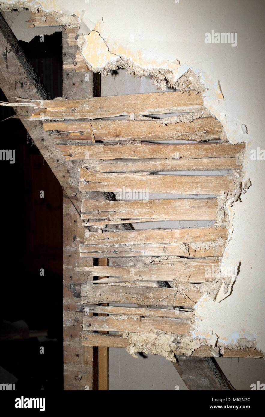 Traditional lath and plaster wall with horse hair in old Cotswold farm house UK Stock Photo