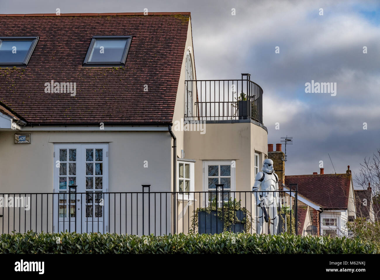 A house in a London Suburb with a lifesize Star Wars stormtrooper on the balcony Stock Photo