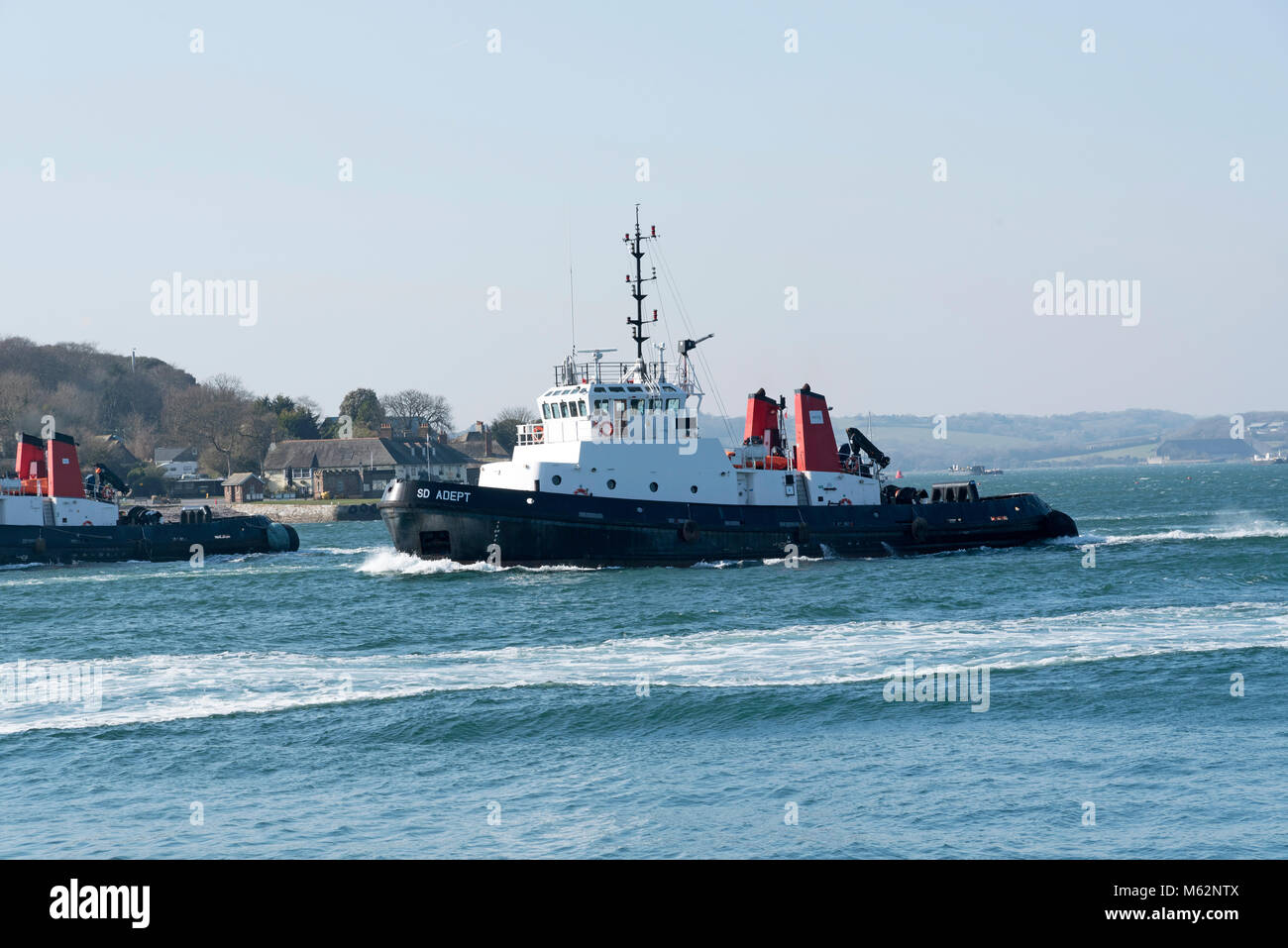 Plymouth, Devon, England, UK. Ocean going tug  SD Adept underway departing Devonport Harbour. February 2018 Stock Photo
