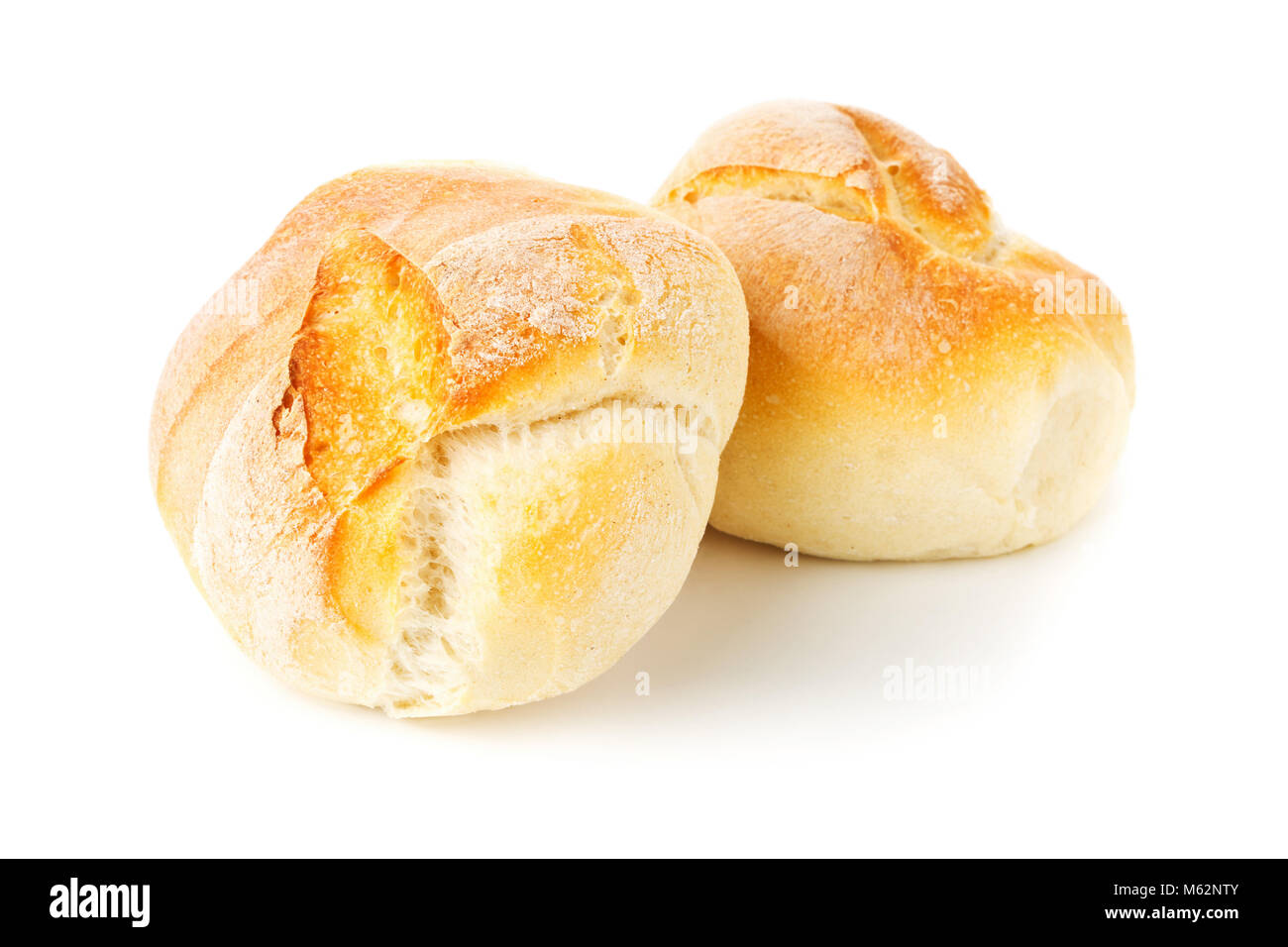 Two whole, fresh baked wheat buns on white background Stock Photo - Alamy