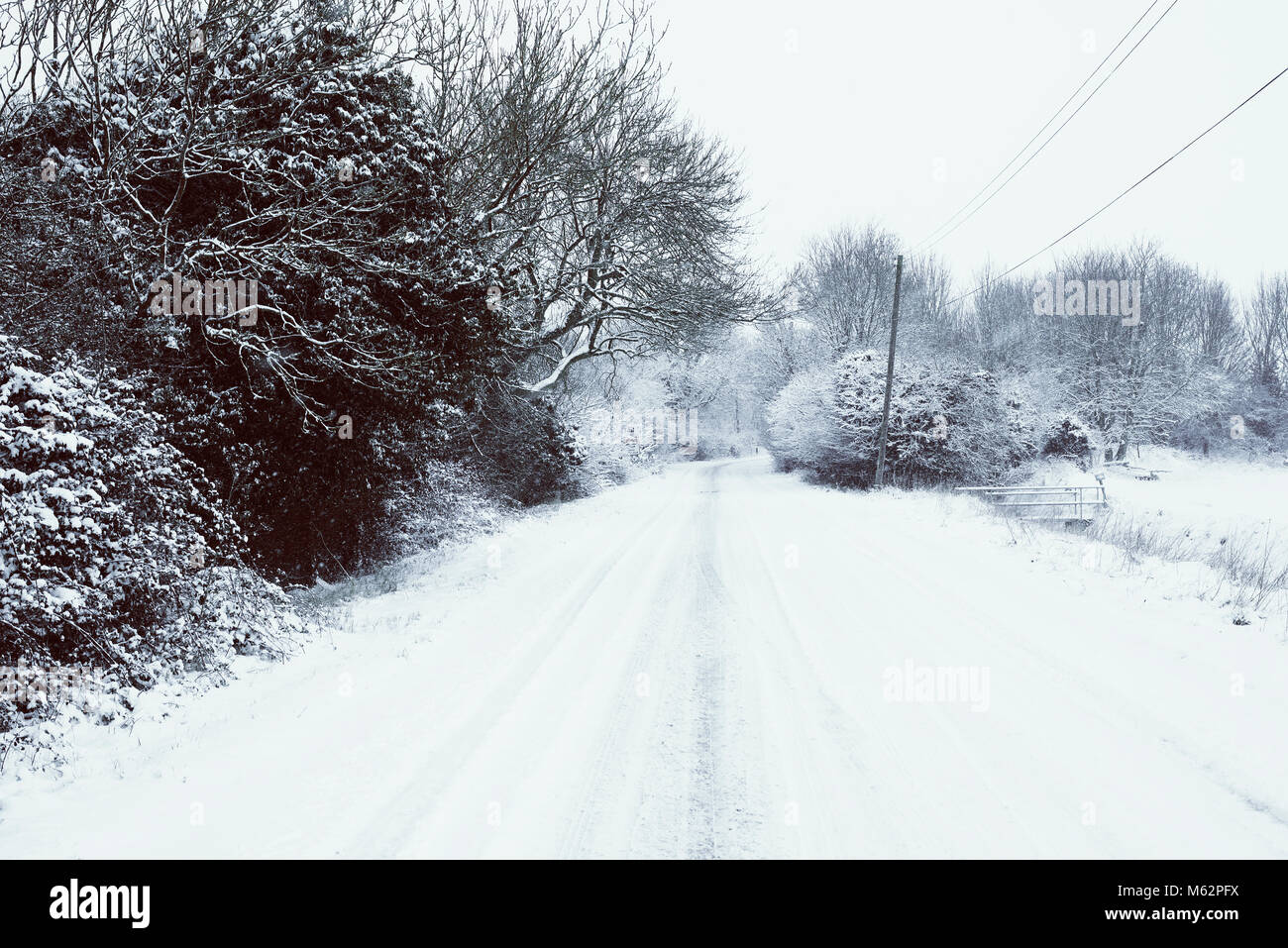 Country road covered in snow and ice Stock Photo