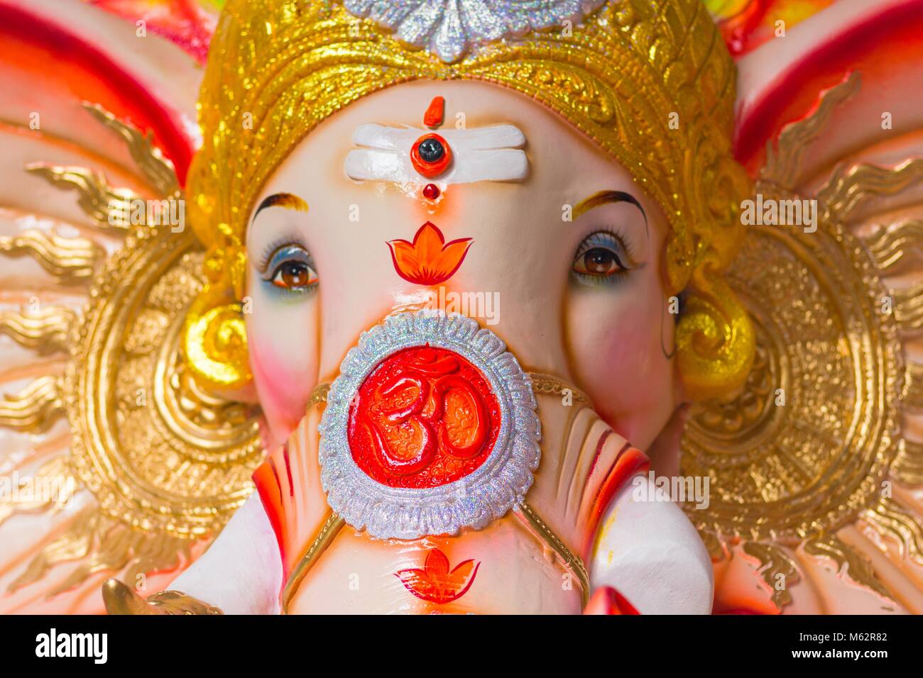 God Ganesha colorful elephant statue to celebrate Hindu Festival Ganesha Chaturthi in India. The Om symbol on the face Stock Photo