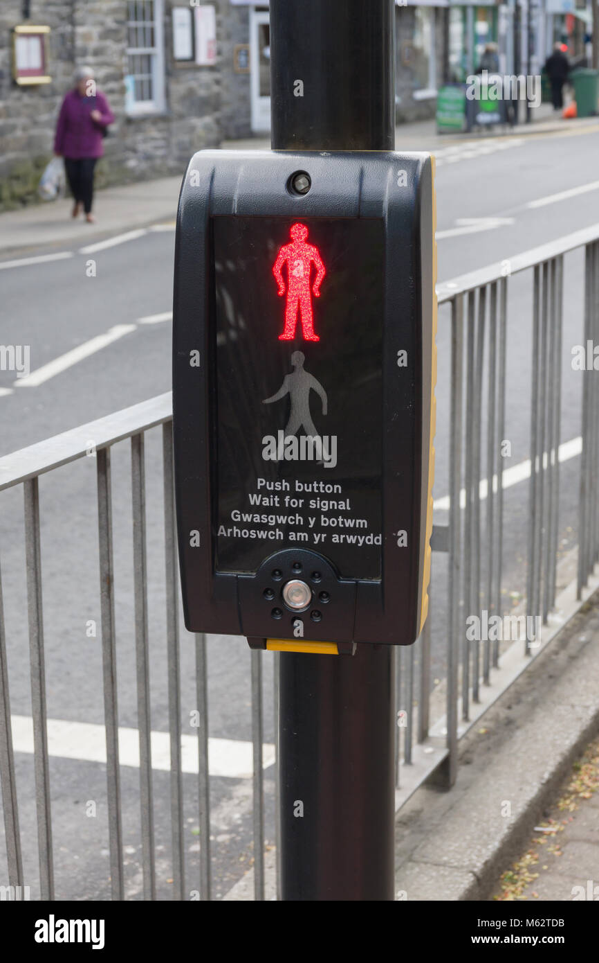 Bilingual Welsh and English language Pelican or pedestrian controlled crossing typically found in Wales United Kingdom Stock Photo