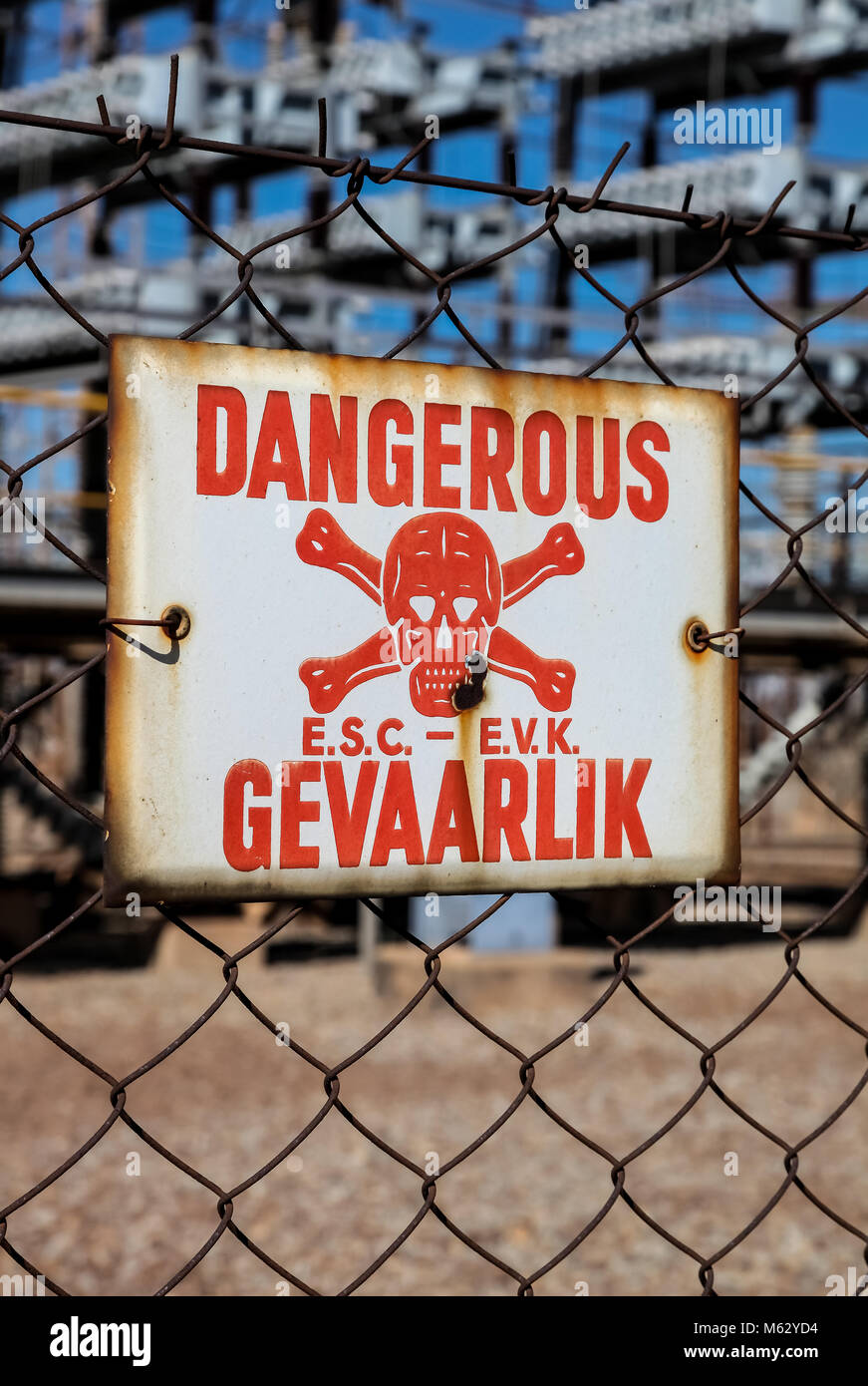 Danger Sign on a fence in English and Afrikaans language Stock Photo